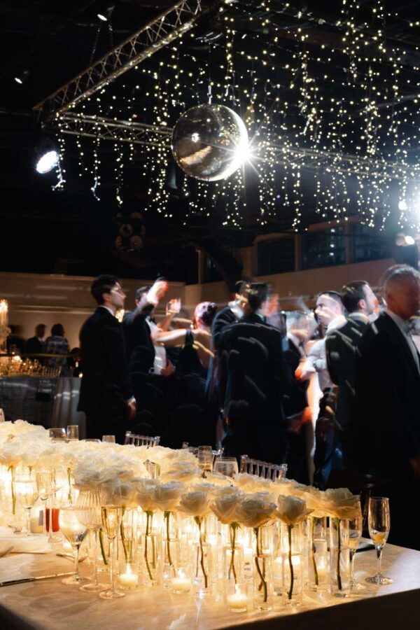 An installation of Fairy Lights and a mirror ball for Taylor and Troy's elegant wedding at The Lighthouse at Chelsea Piers.