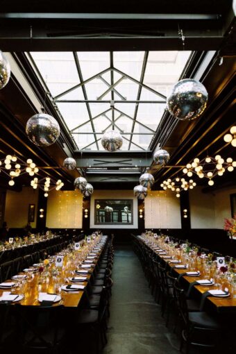 Hanging multiple Mirror Balls in a cluster is a popular addition to the decor for couples getting married at 501 Union.