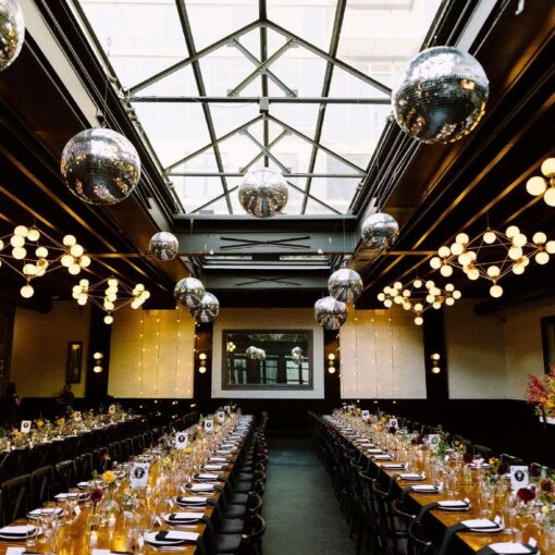 Hanging multiple Mirror Balls in a cluster is a popular addition to the decor for couples getting married at 501 Union.