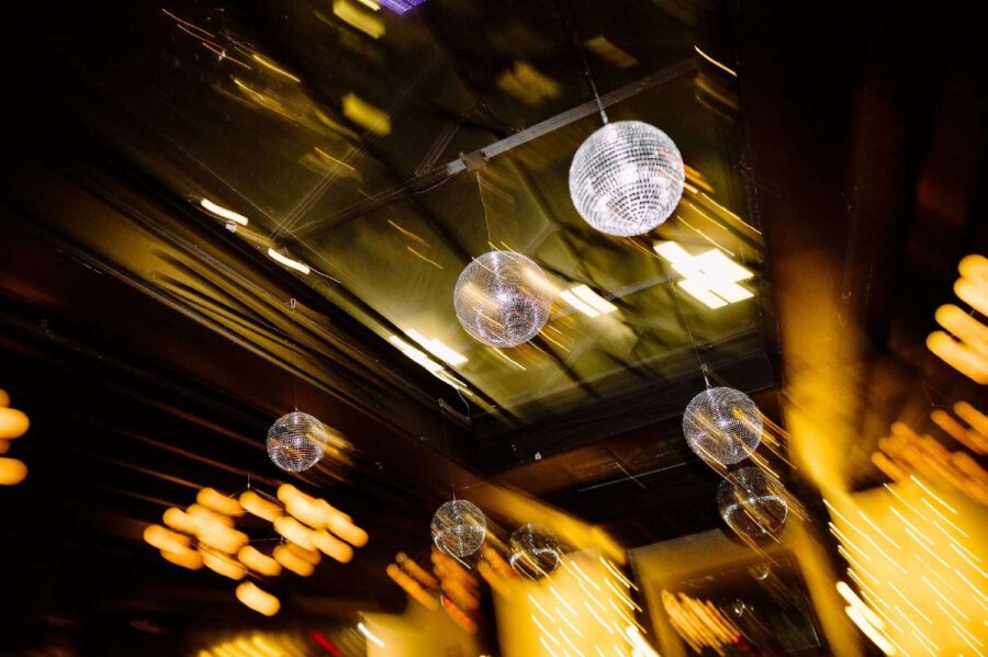 Hanging multiple Mirror Balls in a cluster is a popular addition to the decor for couples getting married at 501 Union.