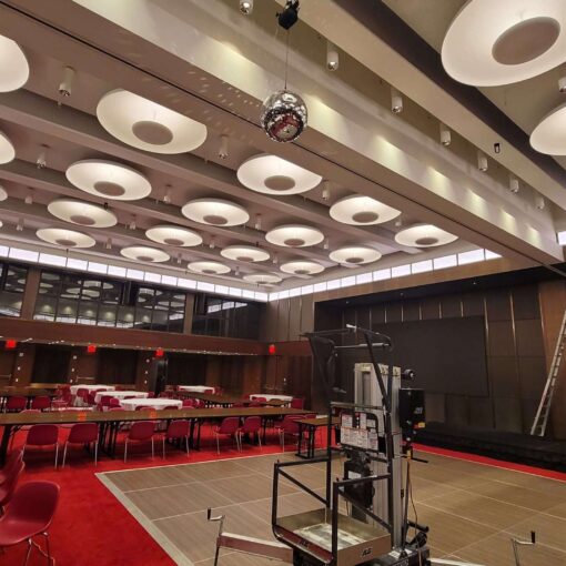 A rotating Mirror Ball hang from the ceiling for a wedding in The Constellation Ballroom at The TWA Hotel.