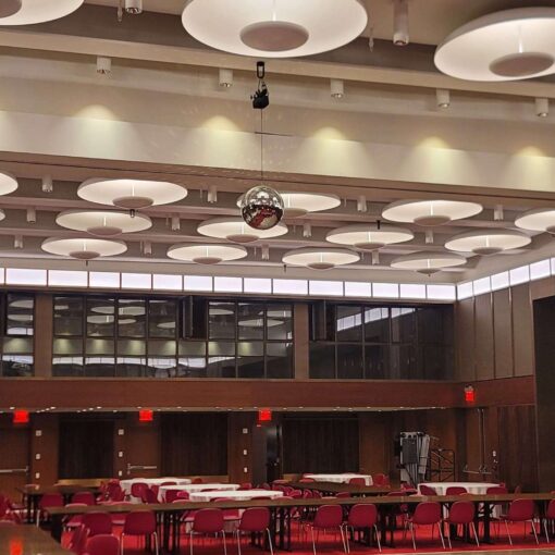 A rotating Mirror Ball hang from the ceiling for a wedding in The Constellation Ballroom at The TWA Hotel.