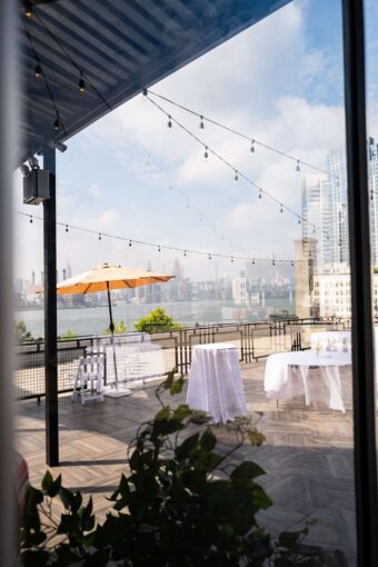 String Lights above the W-Loft's rooftop terrace, alongside panoramic views of Manhattan’s skyline, are a perfect backdrop for a NYC wedding.