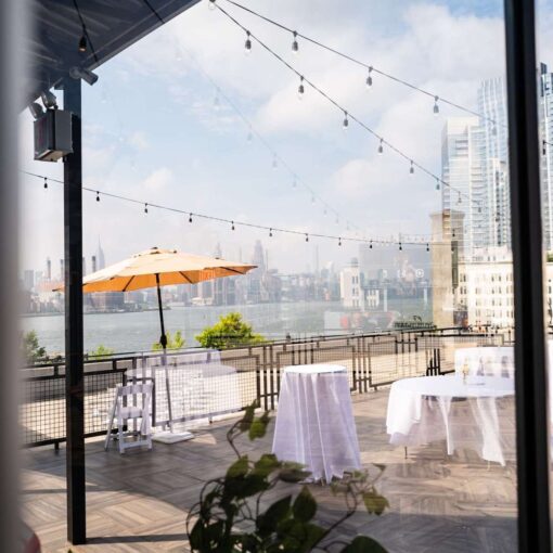 String Lights above the W-Loft's rooftop terrace, alongside panoramic views of Manhattan’s skyline, are a perfect backdrop for a NYC wedding.