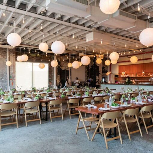 Zigzag string lights with paper lanterns hanging in The Corner Room for Julia + Ray's wedding reception at Rule of Thirds in Brooklyn, NY. Zigzag string lights with paper lanterns hanging in The Corner Room for Julia + Ray's wedding reception at Rule of Thirds in Brooklyn, NY.