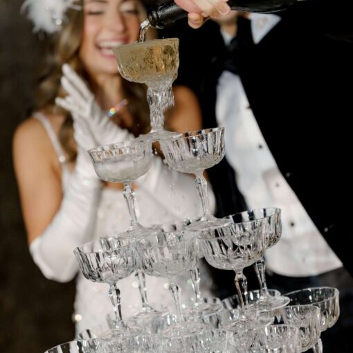 A champagne tower at Pardis & Justin’s Great Gatsby themed Wedding at The Foundry - November 8, 2025