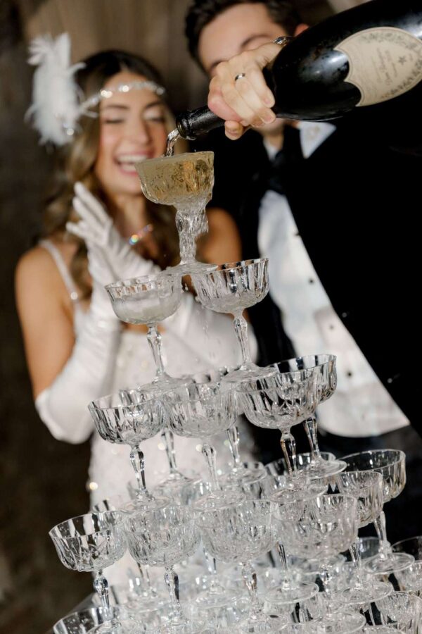 A champagne tower at Pardis & Justin’s Great Gatsby themed Wedding at The Foundry - November 8, 2025