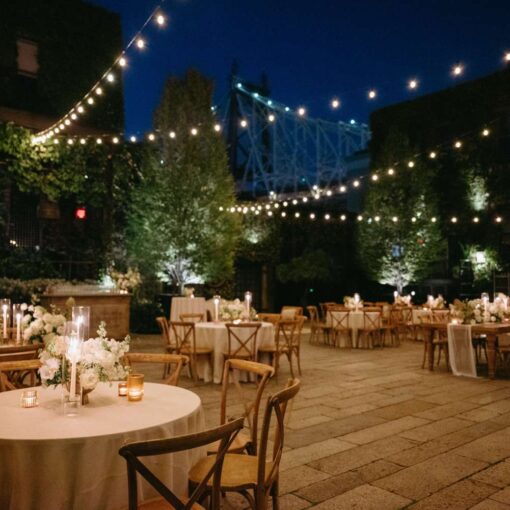 Dining outdoors in The Courtyard under String Lights at Kasey and Andrew's wedding at The Foundry - September 13, 2024