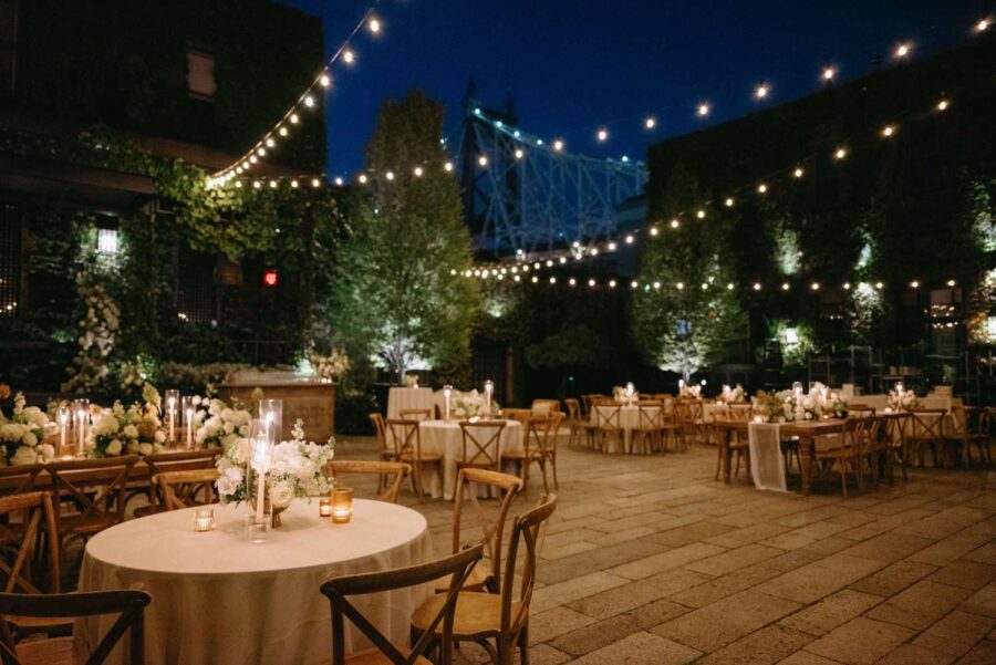 Dining outdoors in The Courtyard under String Lights at Kasey and Andrew's wedding at The Foundry - September 13, 2024