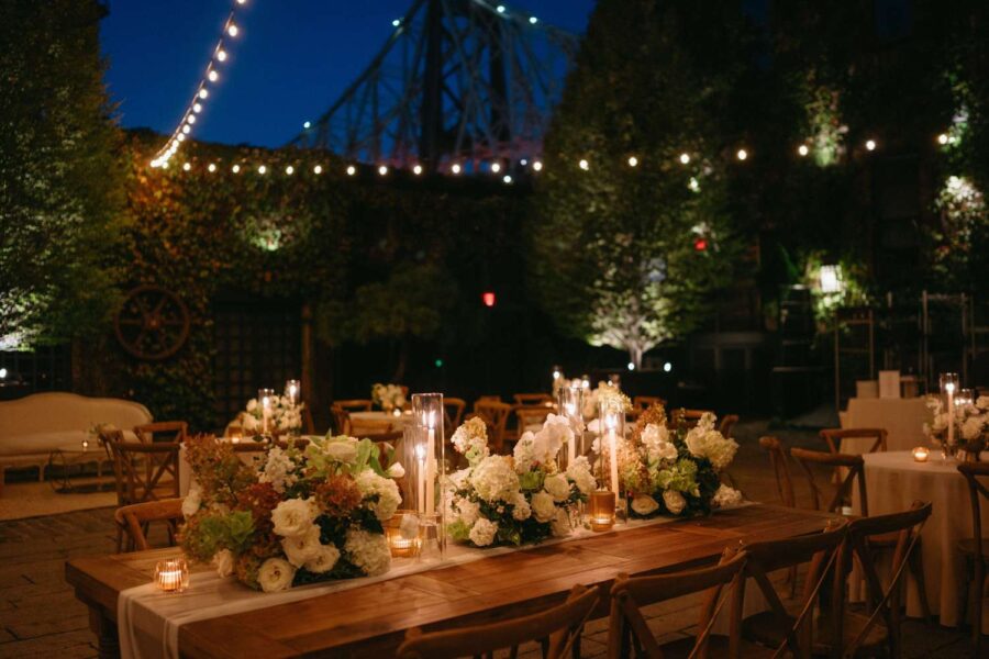 Dining outdoors in The Courtyard under String Lights at Kasey and Andrew's wedding at The Foundry - September 13, 2024
