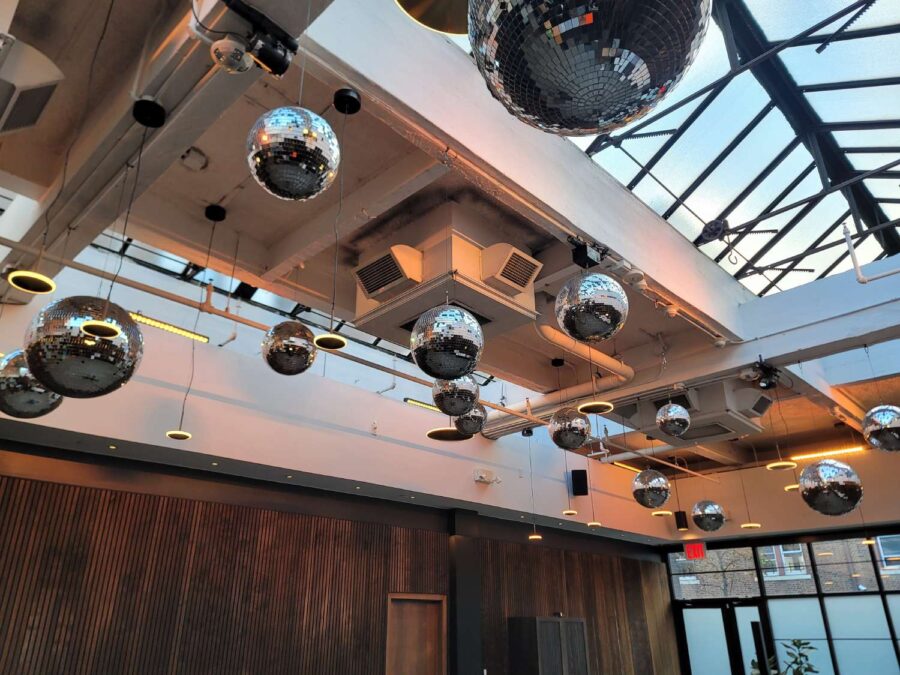 Mirror Balls above the dance floor in the Gallery for a wedding at The Brooklyn Winery, October 31, 2025