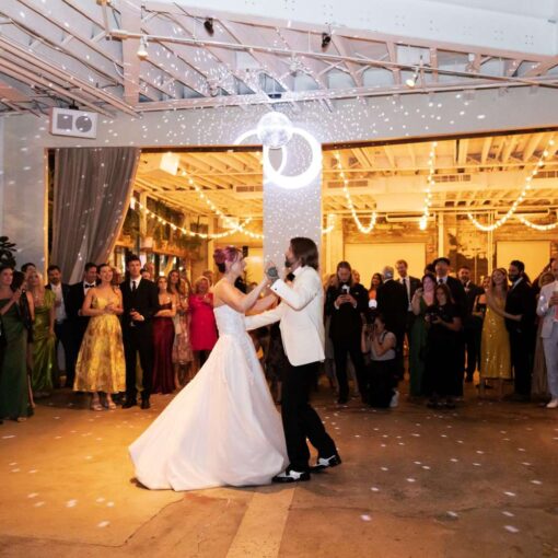 A rotating mirror ball in The Atrium and parallel string lights in The Corner Room at Arden and Keith’s vibrant and colorful Brooklyn wedding at Rule of Thirds.