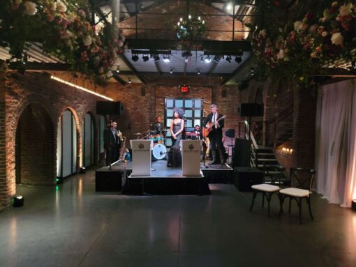 Stage Lighting for On The Move Band performing at a wedding in the main room at The Foundry