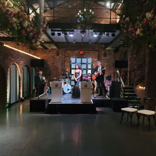 Stage Lighting for On The Move Band performing at a wedding in the main room at The Foundry