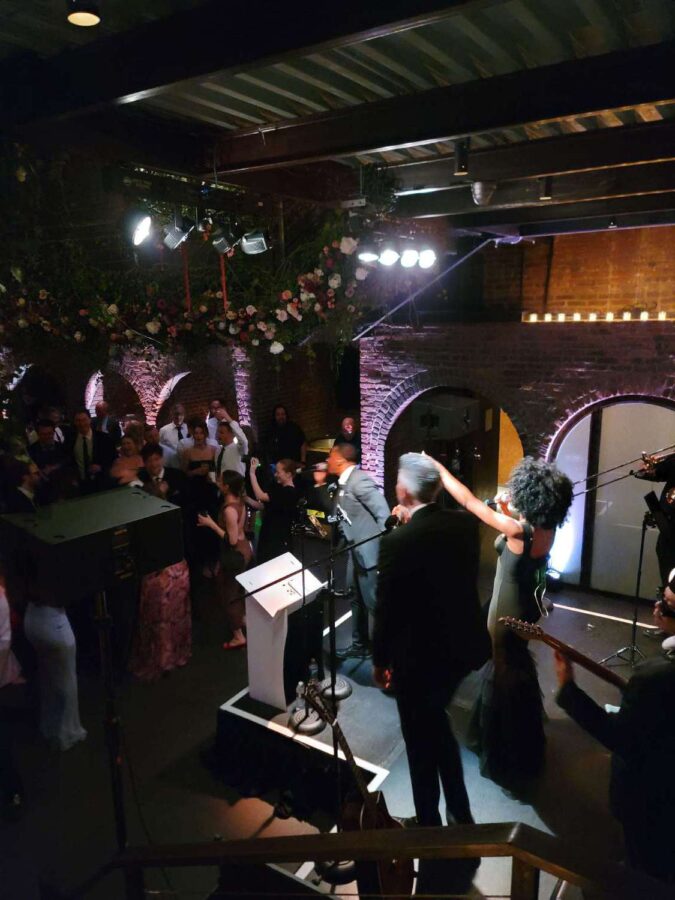 Stage Lighting for On The Move Band performing at a wedding in the main room at The Foundry