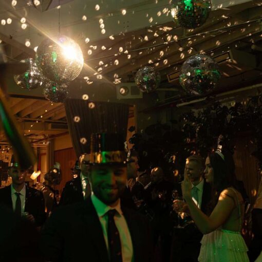 Jessica and Jay's wedding at Rule of Thirds on New Year's Eve with mirror balls and string lights.