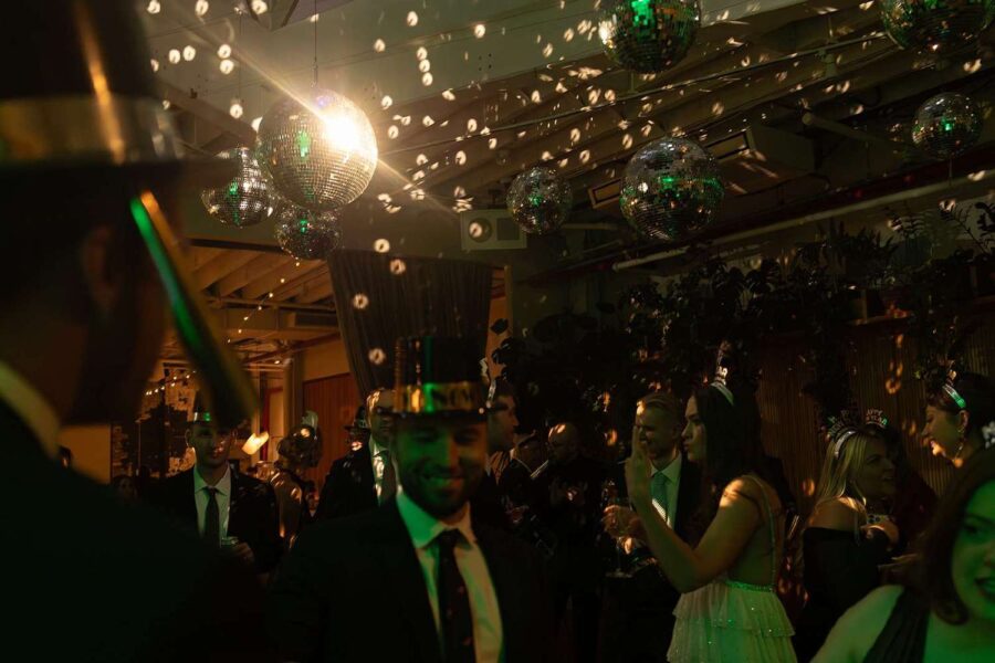 Jessica and Jay's wedding at Rule of Thirds on New Year's Eve with mirror balls and string lights.