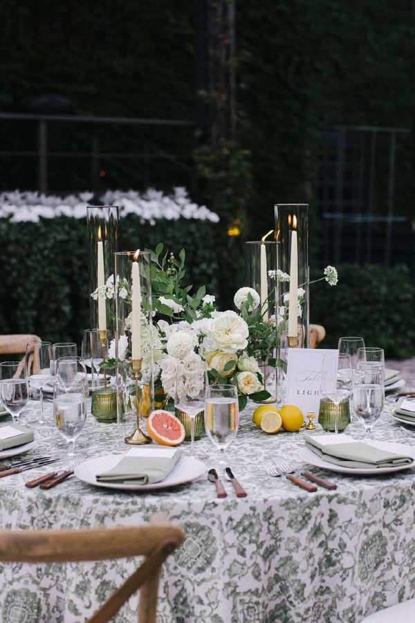 Glass hurricane Candle Shades for a table setting at a Wedding.