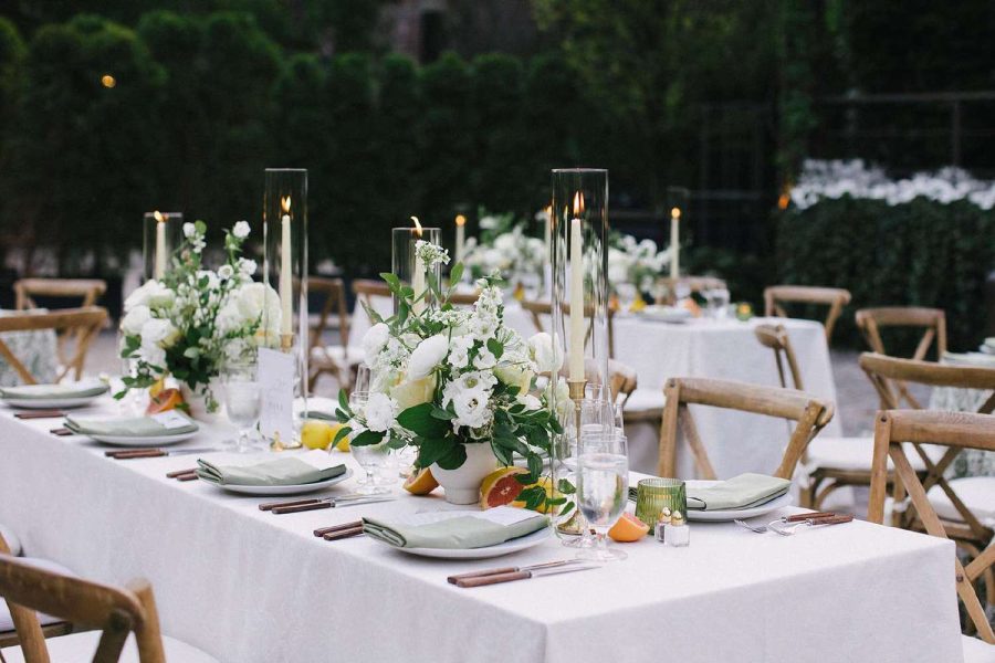 Glass hurricane Candle Shades for a table setting at a Wedding.