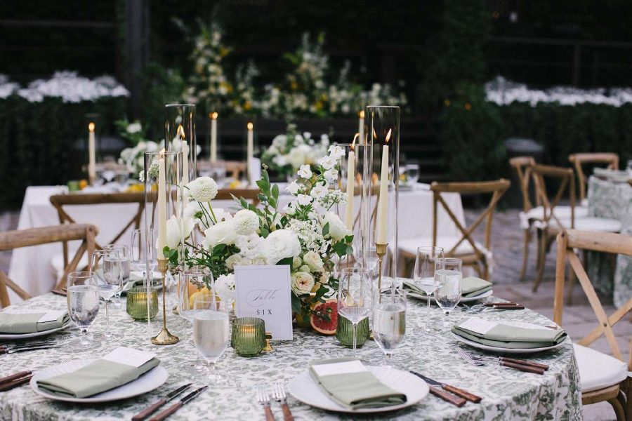 Glass hurricane Candle Shades for a table setting at a Wedding.