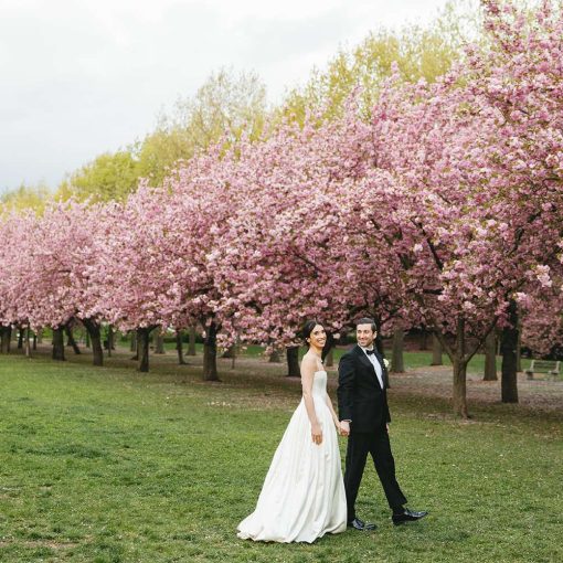 Christina and Cory's spring wedding photo under the iconic cherry blossoms at The Brooklyn Botanic Garden. Christina and Cory's spring wedding photo under the iconic cherry blossoms at The Brooklyn Botanic Garden.