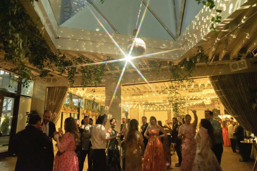A rotating Mirror Ball hanging in The Atrium above the dance floor and String Lights hanging in The Corner Room at Rule of Thirds in Brooklyn, NY.