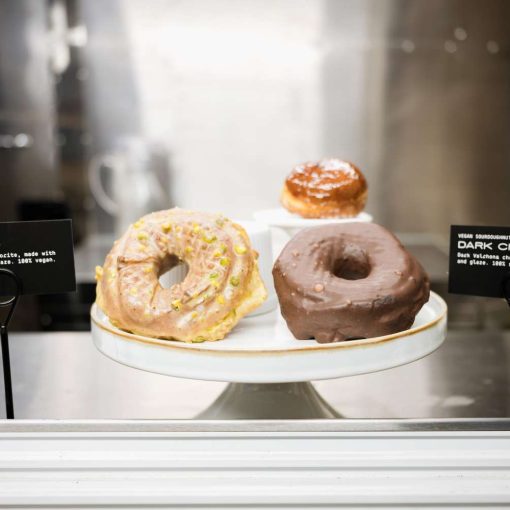 A selection of vegan artisanal doughnuts from Doughnut Plant, a gourmet doughnut shop in New York City