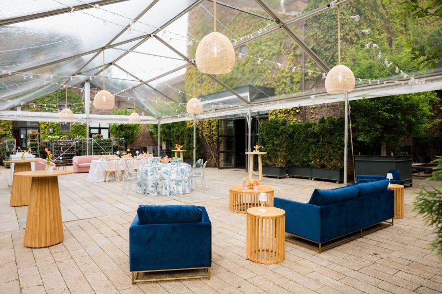 Ace Party Rental set up a clear top tent in the Courtyard at The Foundry for their April Open House. Additionally, Broadway Party Rentals supplied the furniture. Finally, Universal Light and Sound provided the string lights and rattan lanterns.