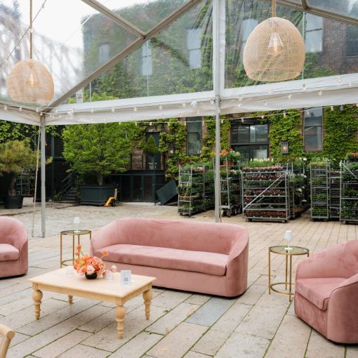 Ace Party Rental set up a clear top tent in the Courtyard at The Foundry. Additionally, Broadway Party Rentals supplied the furniture. Finally, Universal Light and Sound provided the string lights and rattan lanterns.