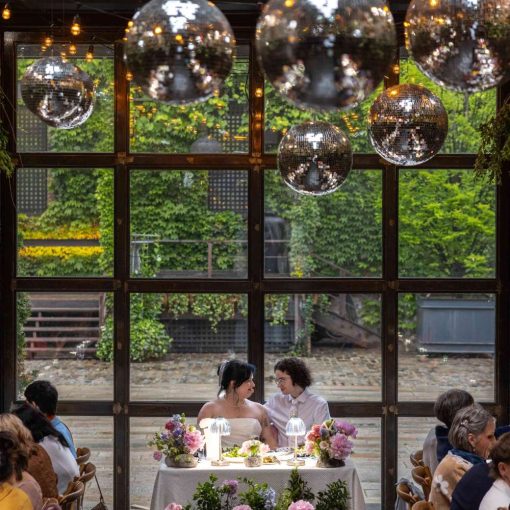 String Lights and Multiple Disco Balls (Mirror Balls) hanging overhead at the Shelby and Beckett wedding at the Foundry in Long Island City, Queens, New York.