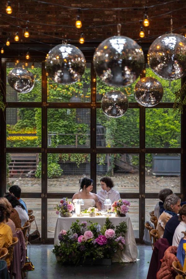 String Lights and Multiple Disco Balls (Mirror Balls) hanging overhead at the Shelby and Beckett wedding at the Foundry in Long Island City, Queens, New York.