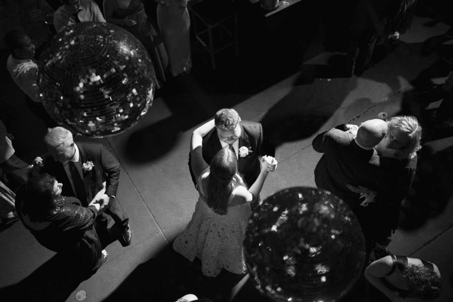 Sophie and David are dancing in the main room under mirror balls in the main room at the Foundry.